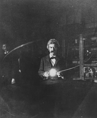 Mark Twain participating in an experiment in Tesla's 5th Ave. lab as Tesla watches from behind.